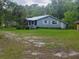 Quaint home surrounded by lush greenery, offering a serene setting at 126 Rattlensnake Trl, Walterboro, SC 29488