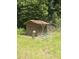 Practical backyard shed with a rustic design, surrounded by greenery at 126 Rattlensnake Trl, Walterboro, SC 29488