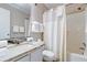 Clean bathroom featuring a granite vanity and shower-tub combination at 1400 Ocean Blvd # 106B, Isle of Palms, SC 29451