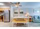 The dining area is adjacent to the kitchen and is part of an open concept living space at 1400 Ocean Blvd # 106B, Isle of Palms, SC 29451