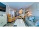 Inviting living room, complete with plush seating and convenient access to the kitchen and dining areas at 1400 Ocean Blvd # 106B, Isle of Palms, SC 29451