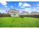 Back yard with a fence and chairs around a fire pit at 141 Sweet Cherry Ln, Summerville, SC 29486