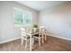 Dining room area with wood floors and a window at 141 Sweet Cherry Ln, Summerville, SC 29486