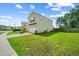Well-maintained home exterior with manicured lawn, attached garage, and easy access to the sidewalk at 141 Sweet Cherry Ln, Summerville, SC 29486