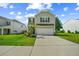 Attractive two-story house with an attached garage, well-kept lawn, and a convenient driveway at 141 Sweet Cherry Ln, Summerville, SC 29486
