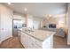 Modern kitchen featuring a granite island with seating, stainless steel appliances, and an open-concept layout at 141 Sweet Cherry Ln, Summerville, SC 29486