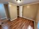 This bedroom features wood-look floors, an overhead light, and a closet at 149 Old Red Hill Rd, Ridgeville, SC 29472
