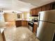 Well-equipped kitchen boasting stainless steel appliances, ample wood cabinetry, and convenient access to the living area at 149 Old Red Hill Rd, Ridgeville, SC 29472