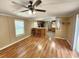 Inviting living area with hardwood floors, bar-style seating, open to the kitchen, and a bright window at 149 Old Red Hill Rd, Ridgeville, SC 29472