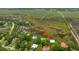 An aerial view showcases this beautiful home surrounded by lush marshland and mature trees at 1520 Regimental Ln, Johns Island, SC 29455