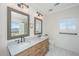 This bathroom features a double vanity, marble countertops, and tile flooring at 1520 Regimental Ln, Johns Island, SC 29455