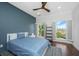 This bedroom features two windows and a blue accent wall at 1520 Regimental Ln, Johns Island, SC 29455