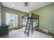This bedroom has a bunk bed with a sofa and a view at 1520 Regimental Ln, Johns Island, SC 29455