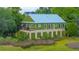 The home boasts a metal roof and marsh views at 1520 Regimental Ln, Johns Island, SC 29455