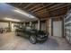 Spacious garage featuring a classic vehicle and ample storage at 1520 Regimental Ln, Johns Island, SC 29455