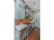 Chef's kitchen featuring custom cabinets, stainless steel range, and brick backsplash at 1520 Regimental Ln, Johns Island, SC 29455