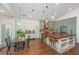 Well-equipped kitchen with custom cabinets, stainless steel appliances, and dining area at 1520 Regimental Ln, Johns Island, SC 29455
