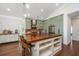 A modern kitchen featuring a spacious island, updated appliances, and custom cabinetry at 1520 Regimental Ln, Johns Island, SC 29455