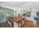 Gourmet kitchen with a large wood island, stainless appliances, and seating at 1520 Regimental Ln, Johns Island, SC 29455