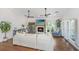 A comfortable living room with a fireplace, plush seating, and large windows at 1520 Regimental Ln, Johns Island, SC 29455