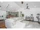 Spacious living room with a large sectional sofa and modern decor, open to kitchen at 1520 Regimental Ln, Johns Island, SC 29455
