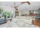 Bright, open floor plan with a stylish sectional sofa, wood floors, and lots of light at 1520 Regimental Ln, Johns Island, SC 29455