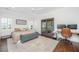 This main bedroom features hardwood floors, neutral tones, french doors, and a ceiling fan at 1520 Regimental Ln, Johns Island, SC 29455