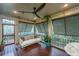 Relaxing screened-in porch with a comfortable swinging bed and views of the outdoors at 1520 Regimental Ln, Johns Island, SC 29455