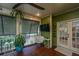 Inviting porch with a ceiling fan, ample seating, and view of the outdoors at 1520 Regimental Ln, Johns Island, SC 29455