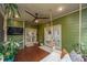 Spacious porch with a swinging bed and doors to the outside at 1520 Regimental Ln, Johns Island, SC 29455