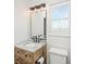 This powder room has a marble sink and accent lighting at 1520 Regimental Ln, Johns Island, SC 29455