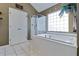 A spa-like bathroom features a soaking tub and glass-enclosed shower at 1664 William Hapton Way, Mount Pleasant, SC 29466