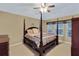 A cozy bedroom features a four-poster bed and a neutral color scheme at 1664 William Hapton Way, Mount Pleasant, SC 29466