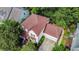 Aerial view of a two-story home with a red-brown roof and a two-car garage at 1664 William Hapton Way, Mount Pleasant, SC 29466