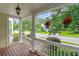 Charming front porch with hanging flower baskets and picturesque street view at 1664 William Hapton Way, Mount Pleasant, SC 29466