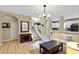 Open floor plan featuring hardwood floors, a modern chandelier, and a view into the kitchen at 1664 William Hapton Way, Mount Pleasant, SC 29466