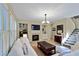 Comfortable living room featuring a fireplace, built-in shelving, hardwood floors, and recessed lighting at 1664 William Hapton Way, Mount Pleasant, SC 29466