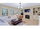 Bright living room with fireplace, modern decor, and ample natural light at 1664 William Hapton Way, Mount Pleasant, SC 29466