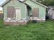 Side exterior with renovation, showing new materials and stone base at 1912 English St, North Charleston, SC 29405