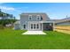 Well maintained backyard with patio, screened porch and wooden fence at 1950 Parish House Cir, Johns Island, SC 29455