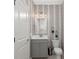 Well-lit bathroom with modern vanity, stylish wallpaper, and contemporary fixtures at 1950 Parish House Cir, Johns Island, SC 29455