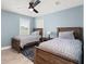 Lovely bedroom with twin beds, wood floors, a window, and a rustic aesthetic at 1950 Parish House Cir, Johns Island, SC 29455