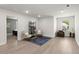Spacious bonus room with stylish armchairs, modern shelving and natural light at 1950 Parish House Cir, Johns Island, SC 29455