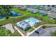 Community pool featuring lounge chairs, umbrellas, covered area, and nearby parking at 1950 Parish House Cir, Johns Island, SC 29455