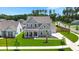 Beautiful two-story home with a manicured lawn, a charming front porch, and a well-kept garden at 1950 Parish House Cir, Johns Island, SC 29455