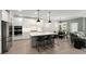 Modern kitchen featuring stainless steel appliances, a large island, and adjacent dining area at 1950 Parish House Cir, Johns Island, SC 29455
