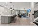 Bright, open-concept kitchen and living room with stylish furnishings and a cozy fireplace at 1950 Parish House Cir, Johns Island, SC 29455