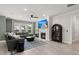 Stylish living room featuring a cozy fireplace, ceiling fan, plush gray sofas and decor at 1950 Parish House Cir, Johns Island, SC 29455