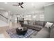 Open-concept space with sleek kitchen, modern dining, and comfortable living area with fireplace at 1950 Parish House Cir, Johns Island, SC 29455