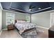 Spacious main bedroom features a trey ceiling, ceiling fan and bedside tables with views at 1950 Parish House Cir, Johns Island, SC 29455